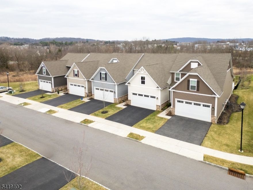 Welcome to the prestigious Village at Hawk Pointe community, a highly sought-after 55+ neighborhood where modern elegance meets effortless living. This beautifully maintained 4-year-old interior townhome offers two floors of thoughtfully designed living space, featuring 3 bedrooms, 3 full bathrooms, and 1 half bath, along with a full finished basement and two-car garage. Designed for both comfort and convenience, this exceptional home includes a desirable first-floor primary bedroom, providing easy main-level living without sacrificing space. Bright and inviting interiors, generous room sizes, and a versatile layout make this home ideal for both everyday living and entertaining. The full finished basement adds valuable additional living space, perfect for a recreation room, home office, fitness area, or guest retreat. Upstairs, additional bedrooms and full bath provide plenty of room for loved ones and visitors. The covered back deck offers up that well deserved area to relax and just enjoy the day. This residence offers the perfect blend of style, function, and low-maintenance living in one of the area's premier active adult neighborhoods where you will be able to take advantage of the tax abatement 'PILOT' program which transfers to the new Owners. This is a rare opportunity to own a newer townhome with exceptional space, desirable features, and an outstanding location.