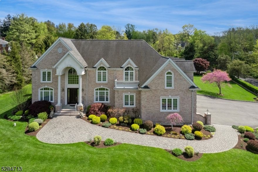 Perched atop of two acres and boasting over 6,000 sq/ft, this custom built home is being offered for the first time. Located in the heart of Warren, countryside views place you near TOP RATED SCHOOLS and just minutes from Rt 78, 287, & Rt 22, you will have an easy commute. Exquisite detail and true craftsmanship provide a subtle elegance throughout. Gather and entertain in a one of a kind kitchen which connects to the family room with wet bar, or escape to the formal living room or den. The designer gourmet chef's kitchen with luxury appliances,  provides all the cabinet space you will need. Upstairs you will find the primary bedroom with vaulted ceiling, multiple walk in closets, and a luxury en suite. The additional bedrooms have their own en-suites and walk in closets. For your convenience the laundry room and office complete the second floor. The unfinished basement provides more than 2,750 sq/ft of space waiting for your touch while the four car garage gives you an entrance into the basement and first floor. Set with plenty of amenities10 foot ceilings, extra wide six foot hallways, first floor bedroom and full bath, secondary staircase,  built in speaker system, security system, gas fireplace, Pella windows with between the glass blinds, four zoned heating & cooling, all brick exterior, grandiose patio, professional landscaping, and more. Set back from the house an oversized detached garage is perfect for the car hobbyist or collector.