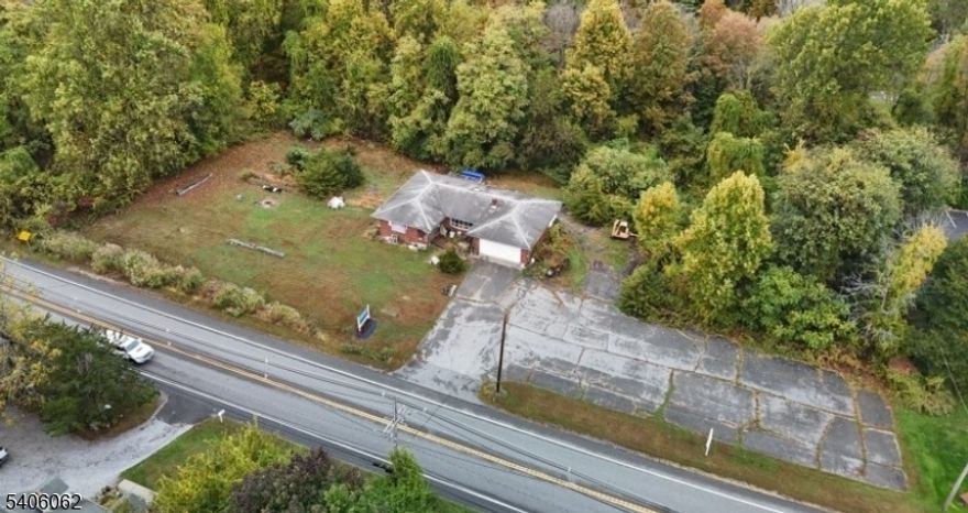 Prime 1.65-Acre C-3 Zoned Residential/Commercial Opportunity. Discover this exceptional parcel in the highly desirable C-3 zone, perfectly positioned on St Rt 94 " adjacent to the year-round Mountain Creek Resort, ski, waterpark, hotel, and premier four-season destination. High visibility and signage potential with approx 312 ft of prime frontage along busy Rt 94 ensuring max exposure for commercial traffic. Existing structure: A former ranch-style home converted for retail/food use, currently vacant. ready for your vision. A blank canvas for immediate redevelopment or res rehab. Flexible redevelopment options: The existing building is well-suited for rehabilitation for commercial uses, retail, restaurant, office, service-oriented, or hospitality-related or conversion to residential. Property lies within the recently approved Vernon sewer service expansion area along Route 94, unlocking major development potential by eliminating septic limitations and supporting higher-intensity uses. This rare offering combines unbeatable location benefits, high daily traffic from resort visitors, proximity to a thriving year-round destination just 47 miles from the George Washington Bridge with strong zoning flexibility and upcoming utility upgrades. Ideal for investors, developers, or owner-users seeking a high-traffic commercial site or adaptable mixed-use/residential opportunity in a growing market. Don't miss this gateway property in one of Northern NJ's premier resort corridors.