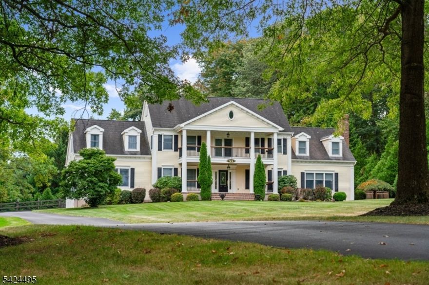 Offered for the first time, 44 Country Acres Drive is a rare opportunity to own a unique Southern style colonial custom in one of Union Township's most sought-after neighborhoods. Set on a beautifully manicured 2.25-acre lot, this stunning four-bedroom, three-bath residence delivers timeless design, elegant detail, and classic charm throughout. Thoughtfully positioned to capture abundant natural light, the home exudes warmth and character at every turn.This beautifully appointed home features custom millwork throughout, along with a full bath and a three-season room on the primary level. The second floor offers a laundry area, an outdoor balcony, and luxurious primary bath. A custom 2-level 15x30 out-building, heated saltwater pool with spa, and private backyard complete the grounds. This truly one-of-a-kind home & property is must-see. 1 year buyer home warranty included.