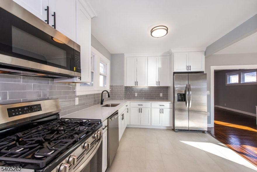 Great newly renovated home! Brand new kitchen with Quartz counter tops w Stainless Steel appliances, nice sized formal dining room. Great hard wood floors! Brand New Roof! New Bathrooms and plumbing throughout! Come inside and make this your home.