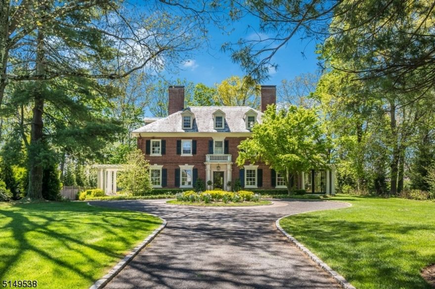 Located in Madison's desirable "Hill section", this grand Georgian Colonial Revival is one of the area's most picturesque historical estates. Originally built in 1907 by A. Wallace Brown, this gracious 6 bedroom, 5.2 bath home has been updated with historically sensitive renovations to be well-suited for today's lifestyles while staying true to its original integrity. Enhanced by high ceilings, original floors, and impressive millwork, the well-appointed rooms overflow with timeless elegance, yet are warm and inviting. The first floor features notable entertaining rooms as well as comfortable everyday living spaces with custom details at every turn. The artfully designed kitchen/family room addition, featured in "House Beautiful" magazine, honors the home's history and architectural style with modern conveniences like professional grade appliances. A recently updated sun porch is the perfect spot for a bright home office or year round sitting room. The upper floors include a large primary suite with oversized dressing room and en-suite bath, as well as five additional bedrooms and three more updated full baths. The large lower level features modern amenities such as a glass enclosed wine room, bright and spacious rec room, home gym and sauna. Outdoor living is equally impressive with mature landscaping for privacy, rich green lawns and brick and marble patio. All this just blocks from Madison's vibrant downtown restaurants and shops, area schools and Midtown Direct train.