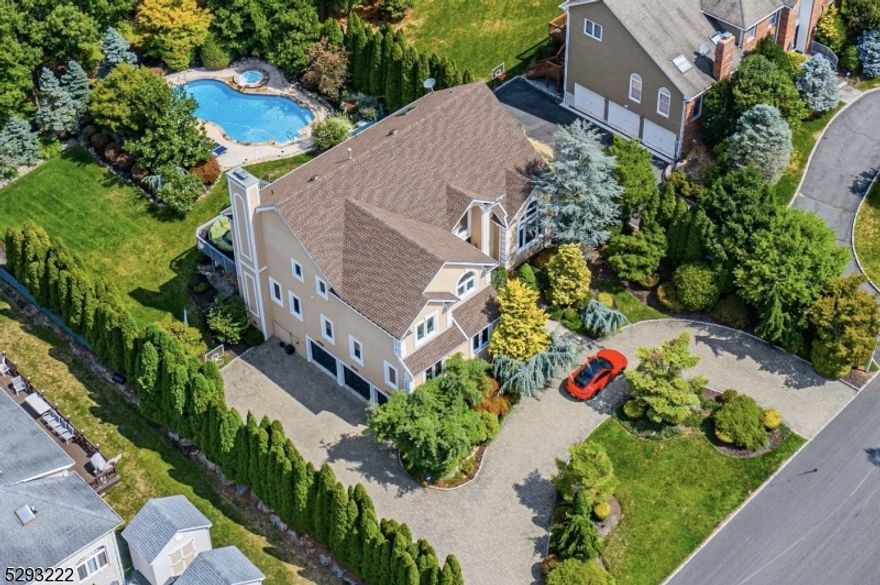 WATCH VIDEO of this beautiful sophisticated modern colonial is located in one of Montville's most desirable area. Attention to detail is obvious the moment you walk through the door. Enter into the grand two-story foyer w soaring ceilings. The modern gourmet kitchen has beautiful custom cabinetry w center island, Sub Zero refrigerator, 6 burner Dacor stove w pot filler & new SS dishwasher & double wall oven. The kitchen opens to a large sun filled family room w a stone gas fireplace, casement windows & beautiful french doors open to large deck, overlooking sprawling yard and pool.  Entertain your guests in the great room located on the main level, with a state of the art home theater set up w automated shades for movie & game nights. Main floor features home office or in law suite w full bath. Second floor features stunning master BR suite w trey ceiling, exotic HW floors, custom built-in cherry wood closets & large marble en-suite bathroom w steam shower. Three additional spacious bedrooms, w exotic HW floors & full bath w soaking tub & custom finishings. Finished WO basment features a state of the art Gym (Equinox style) w Peloton bike & Peloton treadmill, weights, machine & stretching area for Yoga & floor exercises. Resort style yard w large in-ground pool & spa w outdoor music to enjoy the long summer nights in you private outdoor oasis. Professionally manicured grounds w paved circular driveway & finished 3 car state of the art garage w 2 Tesla chargers (indoor/outdoor)