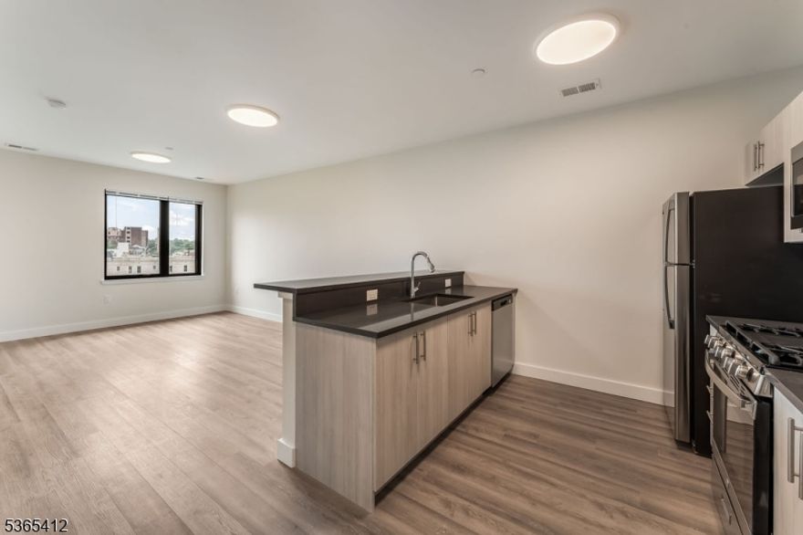 PINNACLE by PEEK is NOW LEASING! Experience the perfect fusion of luxury and convenience with our newly available rentals in Orange, NJ. Ideally located just steps from the Orange Train Station, PINNACLE by PEEK offers a sophisticated selection of studio, one-bedroom, and two-bedroom residences, all thoughtfully crafted for contemporary living. Each unit features sleek, stainless steel appliances, eco-friendly heating and cooling systems to enhance sustainability, and spacious walk-in closets for optimal storage. Residents are invited to enjoy an impressive array of premium amenities, including a resident's game room lounge with outdoor access for socializing and relaxation, a well-equipped fitness lounge to support your active lifestyle, and additional rooftop access for stunning views. Discover a new standard of stylish, comfortable living at PINNACLE by PEEK.