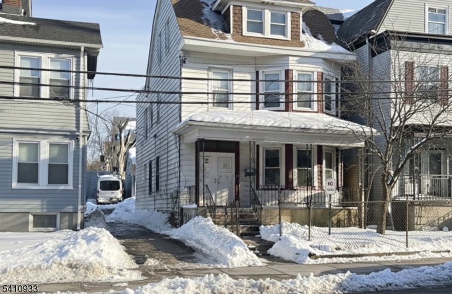 Yes, Parking 2 Car Garage.  Discover this meticulously maintained, maintenance-free multi-family home that defines "turn-key." Low taxes. Whether you are looking for a high-yield investment or a "live-in and let the rent pay your mortgage" opportunity, this property delivers with low taxes and high income potential.The Living Spaces Unit 1: A spacious 2-bedroom apartment featuring a functional layout, perfect for easy occupancy.Unit 2 & Finished Attic: A massive, combined tenancy featuring 4 bedrooms spread across two levels. This unit offers the scale of a single-family home with the income of a multi-family.Move-In Ready: The entire property is pristine and ready for immediate occupancy or market-rate leasing.Parking & Storage Vehicle Accommodations: Rare 2-car detached garage plus a private driveway providing ample off-street parking a premium feature for the area.Massive Storage: Never run out of space with an expansive basement and additional storage capacity in the garage attic.Financial & Physical HighlightsLow Overhead: Benefit from low property taxes and a maintenance-free exterior, maximizing your monthly "take-home" cash flow.Income Generator: Strong rental history with high demand for 4-bedroom configurations in this section of town.