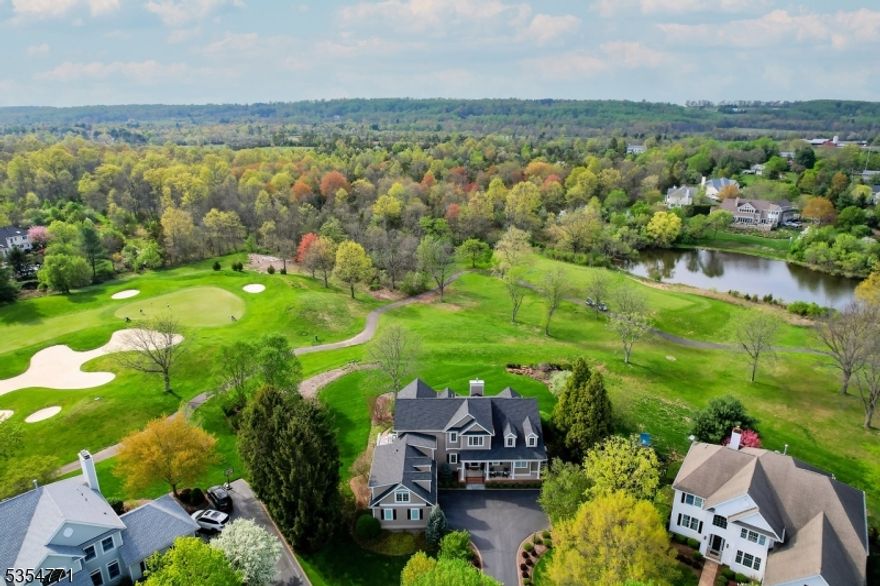 An exceptional residence in Cherry Valley, 17 Banyan Road is one of just two with this rare, custom layout gracing a premier lot between the 3rd green and 4th tee. Breathtaking golf course views are the backdrop to elegant living, from the dramatic two-story foyer with spiral staircase to the sunlit great room with soaring windows and a newly upgraded fireplace. The designer kitchen features quartz countertops, top-tier appliances, and an inviting breakfast area that opens to the deck. The first-floor primary suite is a tranquil retreat with bay window seating, spa-like bath, and a boutique-style walk-in closet. Upstairs, a loft, two bedrooms, and a private guest suite offer versatile living space. The finished lower level includes a home theater, gym, full bath, and more. Extensive upgrades full-home generator, Savant smart system, new hot water heater (2024), Hardie siding, Pella windows and endless upgrades elevate this home even further. Located in top-rated Montgomery Township, minutes to downtown Princeton.