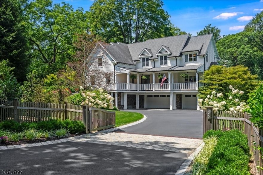 Beautifully renovated with 1790 roots and thoughtful expansions, this urban contemporary Bernardsville residence offers an inspired blend of historic character and sophisticated design. A custom cedar fence encloses meticulously curated landscaping featuring river birches, Japanese maples and seasonal perennials illuminated by ambient exterior lighting. The covered back porch framed by mature privacy trees invites al fresco dining and quiet relaxation. Highlights of the 2022-2024 transformation focus on the kitchen and primary suite. The 2023 chef's kitchen is outfitted with Miele, Thermador and Wolf appliances, frameless push-to-open walnut cabinetry, soapstone countertops, and a Statuario marble island accented by live-edge walnut seating. In 2024, the primary suite received dual California-style closets, recessed lighting, and a full spa bath remodel featuring marble walls, ceiling and floor with a double shower with dual shower heads for a luxurious retreat. On the first floor, an intimate bar and dining room showcases original hand-hewn oak beams beneath a waterfall custom Magma granite counter and built-in coffee station. Practical comforts include a three-car garage with EV hookup; three-zone Nest-controlled HVAC; whole-house water treatment and filtration system; and smart appliances and lighting throughout. Urban contemporary living meets serene country charm in this effortlessly cool Bernardsville gem. Detailed feature sheet available!