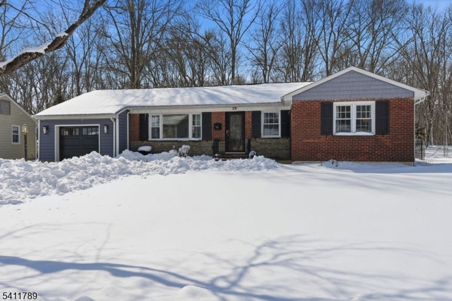 Nestled in one of Berkeley Heights' most sought-after neighborhoods, this beautifully updated 3-bedroom, 1.5-bath ranch offers the perfect blend of comfort, style, and move-in-ready convenience. From the moment you arrive, the enhanced curb appeal sets a welcoming tone. Inside, you'll find a bright and inviting layout highlighted by wood floors, fresh paint, and on-trend finishes throughout. The updated Kitchen showcases modern updates and flows seamlessly into the spacious living and dining areas, creating an open, airy setting ideal living and entertaining. Just beyond, the sun-filled family room features expansive windows and newly installed vinyl flooring, offering durability and a clean, contemporary look. Whether you're enjoying a quiet evening with a book or hosting movie night, this space feels both cozy and connected to the outdoors. The finished basement adds valuable flexible living space perfect for a recreation room, home office, or workout area.  Outdoor living is where this home truly shines.  A fully enclosed privacy fence surrounds the rear property ensuring privacy. The renovated/refinished deck provides an inviting space for entertaining or simply relaxing. Ideally located just minutes from the BH train station and close to major highways, commuting to New York City is effortless. Top-rated schools, parks, and shopping complete this exceptional offering.This is a wonderful opportunity to enjoy updated, easy living in an unbeatable location.