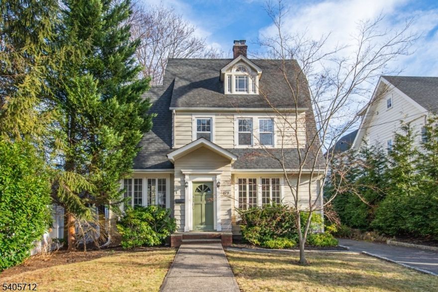 This Charming Dutch Colonial with Craftsman accents like chestnut trim, stunning crown moldings, leaded glass windows, oak floors w walnut ribbon trim, is light-filled and inviting!  First floor boasts large living rm w decorative fireplace, opening to formal dining room.  The updated kitchen, w. custom Cherry cabinets, granite counters, SS appliances and a Wolf oven/stove leads into the sunny breakfast room overlooking the yard.  Open the french door to your deck for morning coffee, a bluestone patio & yard, plus 2-car garage for the tenant's use.  3 bedrooms and a full bath comprise the second floor, while an additional bedroom, full bath w tub and WIC complete the third floor. The basement provides great bonus living space!   A "rec room", plus potential office which could be used as a guest room, full bath w shower and a kitchenette make it a perfect place for guests- there is even a separate entrance for your visitor's convenience!  And speaking of convenience...  shopping and commute are all walking distance.  The village of Upper Montclair, with it's midtown direct train station, boutiques, restaurants and cafes, is under a mile, bus to NYC is on the corner, Brookdale Park is a block away, and the BEST Shop Rite (Brookdale Shop Rite) is down the street.  A great place to settle into the wonderful town of Montclair!   Bonuses: powder room on 1st fl, W/D in basement, Central A/C, garage parking/storage.... Charm + convenience = the perfect Upper Montclair rental!.