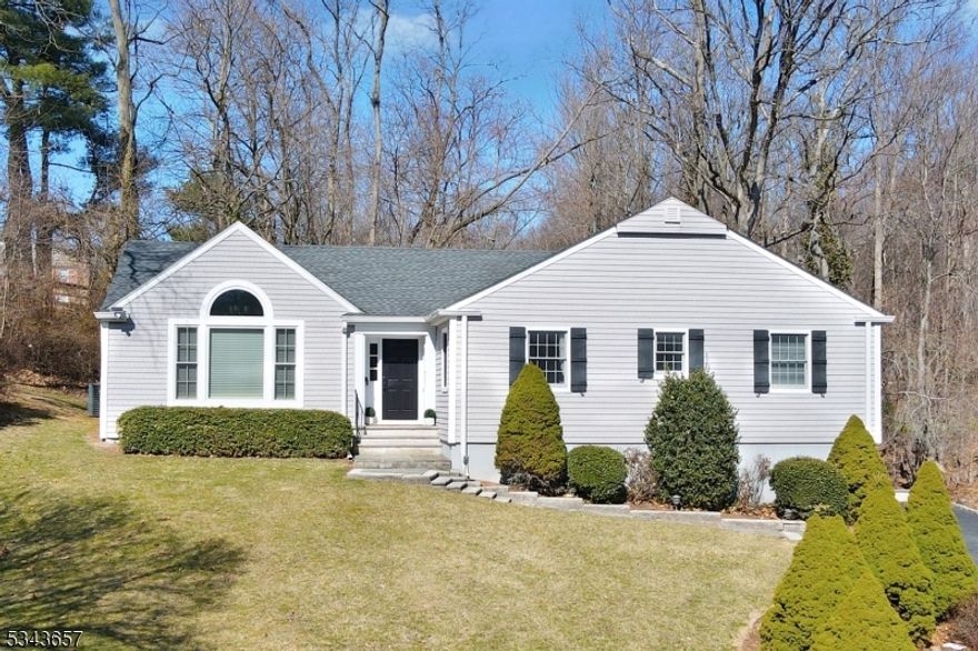 Located in the prestigious Glenwood section of Short Hills, this completely renovated (2017) 4-bedroom, 3-bathroom home offers modern living in a prime cul-de-sac . Nestled on a private, wooded lot with walking distance to Short Hills train station and the highly rated Glenwood Elementary.The home features an open-concept layout centered around a stunning 19' x 32' great room with soaring 12' ceilings and French doors that open to a spacious deck. The chef's kitchen is equipped with a large island, marble countertops, a wine fridge, and seamless flow into the great room perfect for entertaining. The luxurious primary suite boasts two walk-in closets with custom built-ins, master bath with a marble shower and double vanity. Additional highlights include a versatile family/multi-use room, a mudroom, a two-car garage and smart home technology.