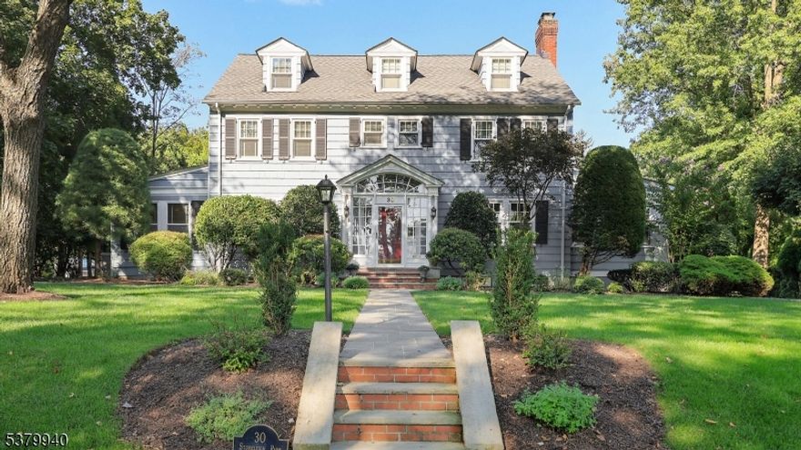 Nestled in the heart of Westfield's historic Stoneleigh Park, this home will captivate with it's stately curb appeal, and tree-lined surroundings. Inside, a spectacular foyer with a sister staircase welcomes you into this classic Center Hall Colonial that blends timeless architecture with modern comfort. The main level boasts beautifully proportioned rooms, rich hardwood floors, built ins, and traditional millwork showcase the home's character. A well-appointed kitchen flows seamlessly to inviting gathering spaces, offering warmth and functionality. Upstairs, spacious bedrooms and serene views deliver a true retreat at the end of the day. The third level is perfect for a guest or nanny suite with a full bathroom, plentiful closet space and spacious bedroom. The finished basement is sound proofed, the rec room features a wet bar and custom built-ins, and the laundry room includes a clothes chute from the second level. Set on a picturesque property surrounded by mature landscaping, and with plenty of room to add a pool,  this home is conveniently located within walking distance from all schools, steps from Westfield's vibrant downtown and train station the perfect combination of elegance, charm, and convenience. Stoneleigh Park is one of Westfield's most distinctive historic neighborhoods, developed in 1904 as a park-like community with tree-lined drives and elegant Colonial Revival and Tudor-style homes, it is listed on the National Register of Historic Places.