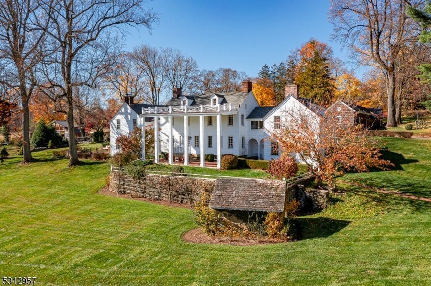 "Black River Farm" - A 52-acre preserved farm located in a bucolic section of Chester Township that is cherished for its country estates and equestrian properties. The land is sublime and surrounded by parkland, ensuring that the tranquility and natural beauty of this farm will remain in perpetuity. A long gravel driveway crosses fenced pastureland and a meandering brook to reach the main residence.  This stately antique Colonial Revival was expanded in the mid-1800's and has been restored and renovated over the past twenty years by the current homeowners. Throughout the home, modern amenities have been thoughtfully blended with many of the original architectural details. The kitchen was expanded to include a large island, ample cabinetry, and a sitting area with a gas fireplace.  A charming two-story cottage features two bedrooms, two full bathrooms, an eat-in kitchen, office and two covered porches.  The cottage is also a legal rental property. Outbuildings and other amenities include an antique (circa 1890) two-story timber frame bank barn used for social events, a pool pavilion with an open lounge that adjoins an outdoor kitchen and spa, a detached three-car garage, an equipment barn with garage space for two more vehicles, a renovated corn crib, a chicken coop, a fieldstone spring house and a heated Gunite pool framed by a level lawn and bluestone patio. Throughout the farm, there are spellbinding views of this incredible setting.