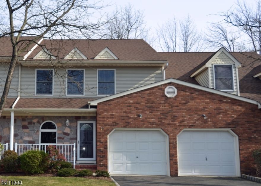 Located in Log Cabin Estates, this spacious townhouse offers comfort, style, and thoughtful updates throughout.Step into a bright and airy living room featuring a dramatic cathedral ceiling, gleaming hardwood floors, and a cozy gas fireplace   perfect for relaxing or entertaining. The hardwood flooring continues into the formal dining room, creating a warm and cohesive main living space. Door from the living room lead directly to a private deck, ideal for outdoor dining or quiet mornings.The large primary suite provides a true retreat, complete with wall-to-wall carpeting, two generous walk-in closets, and a full en-suite bath featuring a jetted soaking tub and separate stall shower.The eat-in kitchen is equipped with a gas cooktop and stove, dishwasher (2018), and ample space for casual dining. Major updates include a new A/C system (2017) and garage door replacement (2012), offering added peace of mind.The fully finished basement expands the living space with an impressive 21-foot family room featuring an electric fireplace, a separate office area, tiled storage space with shelving, a dedicated laundry room with washer and dryer, and a utility room.This well-maintained home combines spacious living areas, modern conveniences, and a desirable location   making it a wonderful place to call home.