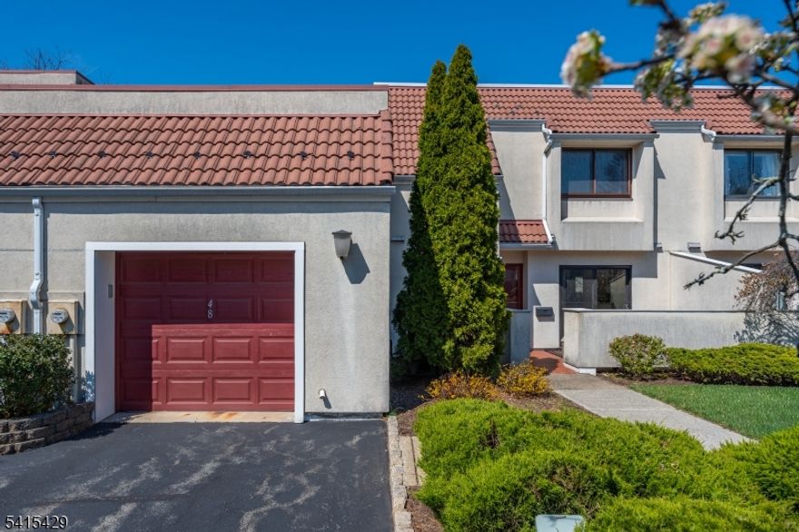 Beautiful, updated unit in the gated community of Eagle Ridge.Walk directly into a very spacious first floor, featuring an updated eat in kitchen,with new sliding doors leading to a private patio.There is a separate dining area and a generous family room with a wood burning fireplace, slider's opening out to a second deck, great for entertaining or relaxing. A versatile side room offers the ideal space for a home office, play room, den, can be closed for a potential bedroom.The first floor includes a lovely half bath, a separate laundry area, direct access to garage and extra closets.Second floor you will find two very spacious bedrooms, plenty of closets,each with its own updated ensuite bath. Eagle Ridge offers resort style amenities including indoor/outdoor pools, a modern gym, pickle ball, tennis and basketball courts.Close proximity to shopping, parks,dining, Turtle Back Zoo,Codey Arena, and more.Convenient to all major highways with a jitney to trains, right in front. All you need to do is unpack.