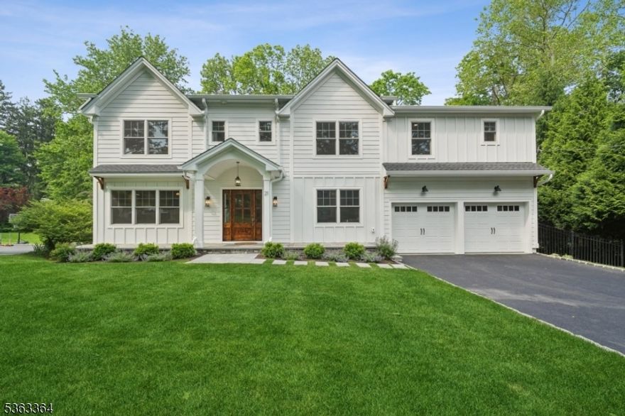 This exquisite 6-bedroom, 5.5-bathroom home is nestled in a cul-de-sac and built by JTS Build & Design on a 0.34-acre lot. It features James Hardie Plank siding, a stone veneer foundation, and Board and Batten accents. Conveniently located just steps from downtown Madison and the train. A 40-year Timberline roof and Andersen windows ensure durability and style. The exterior boasts a bluestone front porch, a Craftsman-style  entry door, elegant paver walkways, and a backyard patio. Inside, extensive millwork, crown molding, designer light fixtures, and 8" white oak flooring add sophistication. The first floor includes a living room, dining room, gourmet kitchen, and family room with a gas fireplace, while the mudroom features shiplap walls, hooks, and a bench. The walk-out lower level offers a bedroom, full bath, rec room, and gym/storage. The second floor has five bedrooms, four full baths, and a laundry room with custom cabinetry. The primary suite boasts a spacious walk-in closet and a spa-like bathroom with a standing shower, soaking tub, and double vanity. The gourmet kitchen features custom shaker cabinetry, a quartz island, and Thermador appliances, including a 48" gas range with a custom hood. Modern conveniences include LED recessed lighting, a two-zone high-efficiency HVAC system, and a 75-gallon water heater. A full landscape package with sprinklers, sod grass, and decorative bushes completes this home. Madison tax assessor has stated that NEW taxes will be $25,300.