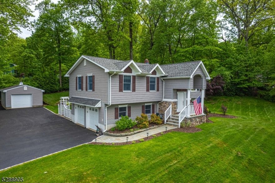 Immaculate, Bright Custom Bi-Level. Quality craftsmanship and fine detailing throughout. Located on Corner lot in a quiet Neighborhood. Lots of Generous Room Sizes to Spread Out & Make Your Own! Layout offers versatile options! GREAT house for entertaining or everyday living. Large living room w/big picture window offers tons of natural light. Recently renovated custom kitchen. Granite countertops, maple cabinets, stainless steel appliances, gas cooking & separate dining area. Lovely sitting area w/matching granite desk & built ins. 3 large bedrooms & 2 full bath upstairs includes the primary suite w/bath & walk-in. 4th bedroom on lower level. Fully equipped w/powder room, office space & laundry/mudroom that walks out to the backyard. An oversized family room w/WB fireplace adds character while helping to keep the house warm & cozy in the colder months. Over 2600 square feet. 2 car garage attached with inside entrance & 3rd bonus detached garage. The backyard is beautifully landscaped with a patio & deck. Tons of parking, with a circular driveway! Almost a full acre. An ideal spot to relax & enjoy life. NATURAL GAS- could be converted from oil to natural gas. Just a short drive to the bustling Downtown, Union Hill Center, Morristown, Chester, Dover, tons of shopping and restaurants! NYC Direct Mass Transit & easy access to major highways such as 80, 10, 46 & 287. Top rated schools.