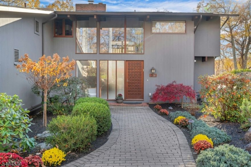 Discover this stunning custom designed contemporary home featuring soaring ceilings in the foyer and family room, creating an open and airy ambiance. The chef's kitchen boasts a sleek white design with upgraded appliances, perfect for culinary enthusiasts. Enjoy four fully renovated bathrooms, offering modern luxury throughout. Relax and rejuvenate in your private indoor heated lap pool, and take in year-round water views of Clyde Potts Reservoir from every window. Nestled in a prime location on 3 superb acres, this home offers access to highly rated Mendham Township schools, and is just minutes from shopping, dining, and major highways. Experience the perfect blend of style, comfort, and convenience.