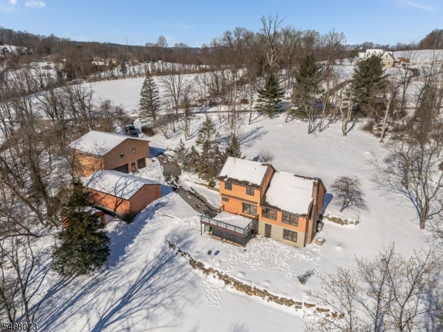 The PERFECT Property for HOBBYST of just about ANY TYPE! Such a RARE & Special FIND! What a GREAT package...a 3 BR, 2.5 Bath CONTEMPORY Home NESTLED on a Gorgeous & Partially Wooded 5.28 Acre Parcel offering Amazing VIEWS, a 2 CAR Built-in GAR, a 40x20 3 Car DETACHED GAR w/ELECTRIC, a 10x20 SHED with OVERHEAD Door and Drum Roll please...A HUGE KISTLER TWO STORY POLE BUILDING with 2 ZONED Propane Heat, A/C, INSULATED Overhead Doors & access Door, Overhead FANS, SEPARATE Electric Service, a "HIDDEN" Room and TWO Large Finished Rooms in upper level! The 2nd FLR has w/w Carpeting, Fluorescent Lighting, PELLA Windows, FRENCH Doors & More! There is a ton of NATURAL Lighting! This IMPRESSIVE Pole Bldg Must be Seen in Person to truly Appreciate! The POSSIBILITIES are ENDLESS with this Property! INCREDIBLE Opportunity for a COLLECTOR, CONTRACTOR, HOBBYST, ARTIST and the list goes on! SUCH A TREASURE! The House offers a GREAT RM w/CATHEDRAL Ceiling, STONE WALL & FIREPLACE, HARDWOOD Flrs, an OPEN & SUN-FILLED Layout, a CENTER ISLAND Kit, a partially Fin WALK-OUT LL w/WOOD STOVE, a WALK-UP Attic, a BUILT-IN 2 Car Gar, COMPOSITE Deck with VIEWS and PAVER PATIOS! The 5.28 AC Property is Spectacular & hosts a VARIETY of MATURE Trees including FRUIT TREES! Add'l amenities include Generator HOOK-UP, CENTRAL VAC, Lrg WALK-IN Closet & Storage Rm & C/A!  Private Well & Septic! Just MINUTES to COMMUTER Routes & Most CONVENIENCES! Hurry, You will not find another property like this, it Won't Last!