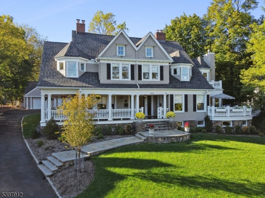 Move right into this warm, inviting home ideal for indoor and outdoor entertaining that blends everyday luxury with unparalleled convenience in the heart of Upper Montclair. Just 2 blocks to the NYC train, top dining, shops, and the Bellevue Theatre, this home offers city-like accessibility with neighborhood charm. Inside, the chef's kitchen is a true showpiece with a Wolf range, SubZero fridge, warming drawers, dual dishwashers, two sinks and a natural gas fireplace. A large center island and access to the gas-connected grill deck make this space perfect for both daily living and entertaining. The 1st floor also features a living room with exquisite millwork and a gas fireplace, a formal dining room with gas fireplace and seating for 12, a rotunda-style family room, and a powder room and mudroom for everyday ease. Upstairs, the luxurious primary suite awaits with an attached private office, marble bath and large walk-in closet. Four bedrooms - two with en suite baths - a hall bath, and luxe laundry rm complete the 2nd floor. The 3rd floor includes two more bedrooms, a full bath, and a bonus room. Versatile basement includes wine room, gym, hobby room, family room, a custom sensory gym (with home theater potential), and powder room. Enjoy the outdoors: mahogany wrap-around porch is perfect for relaxing, dine al fresco on the kitchen deck, roast s'mores on the bluestone patio. Invisible fence. 3-car garage with full 2nd fl ready for finishing. A true gem!