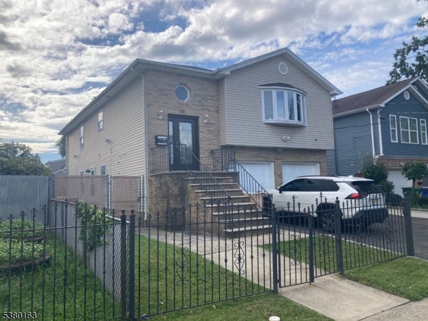 Updated 3 bedroom 1st floor apartment of a two family home. Features include a kitchen w/ newer cabinets, quartz countertops, stainless steel appliances, and a newly renovated bathroom. Enjoy central air, an in unit washer/dryer hook up and shared paved backyard space. Garage not included.
