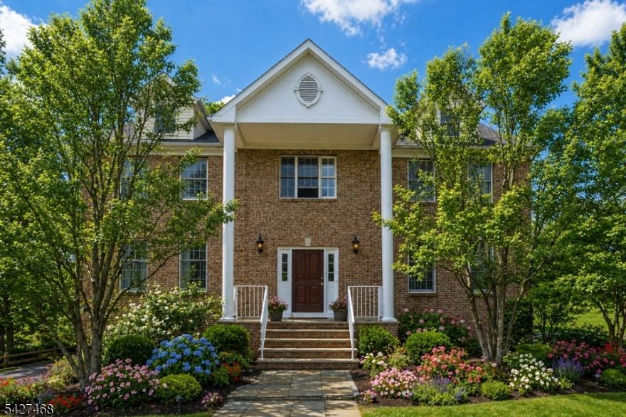 Welcome to a stately, classic Colonial set on a private, park-like setting near Union Hill Farms. Nestled on nearly 2 acres of property & backing to 8 acres of protected, town owned wooded land, this home offers exceptional privacy, serene surroundings & timeless curb appeal. A sweeping approach from Cooper Rd/Druid Hill which allows for privacy, leads to this impressive 4 BDRM, 3.5 bath residence offering over 5,600 sqft of living space. Built by the original Cedar Gate contractor, the home showcases quality craftsmanship & a commanding presence. A grand 2 story foyer sets the tone, opening to a bright, open concept layout ideal for both everyday living & upscale entertaining. The gourmet chef?s kitchen features a large center island, butler?s pantry with sink & sunlit breakfast area, seamlessly flowing into the expansive family room. Additional standout spaces include a sun drenched conservatory, perfect for a billiards room or lounge & a private 2nd floor office. The luxurious primary is a true retreat, complete with an oversized sitting room with fireplace & a spa-like ensuite bath. Step outside to the expansive deck, ideal for entertaining or enjoying peaceful sunrises & sunsets surrounded by nature. Full basement with endless potential, attached 3 car garage & close proximity to DWTN Denville, Union Square shopping, Morristown Green & NYC direct train access. This one-of-a-kind luxury home offers the perfect blend of privacy & convenience in the heart of Morris County.