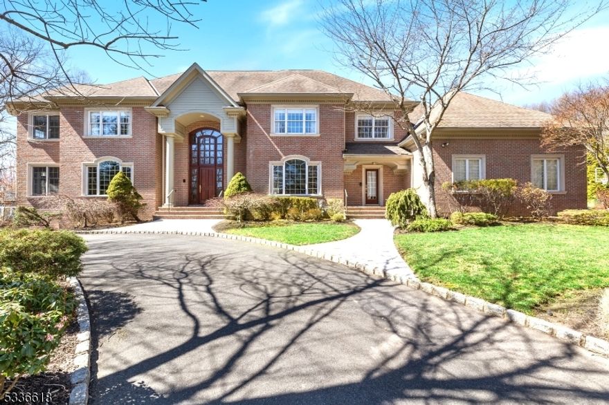 This grand, designer,  luxury Home is an oasis nestled in a magical setting at the end of a long driveway. The formidable residence boasts 7 bedrooms, 7.5 baths, 5 fireplaces, and a heated 4-car garage. Built by a renowned local builder, its 3-sided brick exterior & exceptional amenities reflect the pinnacle of refined living. Inside, the home features an elevator for swift access to all 3 levels; including a sun-drenched walkout lower level. A welcoming 2-story foyer of twin mahogany doors opens to inviting rooms showcasing inlaid wood flooring and large rooms bathed in ambient light.  The interior is smartly configured with a private office boasting dual gas fireplaces, a wet bar and a formal dining room. The heart of the home is its expansive family room and beautifully appointed kitchen with abundant cabinetry, center island and unobstructed views of the magnificent rear grounds. A 1st floor guest, ensuite complements the second-floor, primary suite with a fireplace, sitting room, and luxurious bath. Four more spacious bedrooms with high ceilings and three full baths complete the 2nd floor while a finished, walkout lower level offers another large bedroom, full bath, rec room with fireplace, media room with wet bar, game area and a gym. The amazing outdoors feature a newly renovated Gunite pool and a fabulous, newly built cabana with an outdoor shower, firepit, designer outdoor lighting with moonlit foliage and an outdoor sound system.