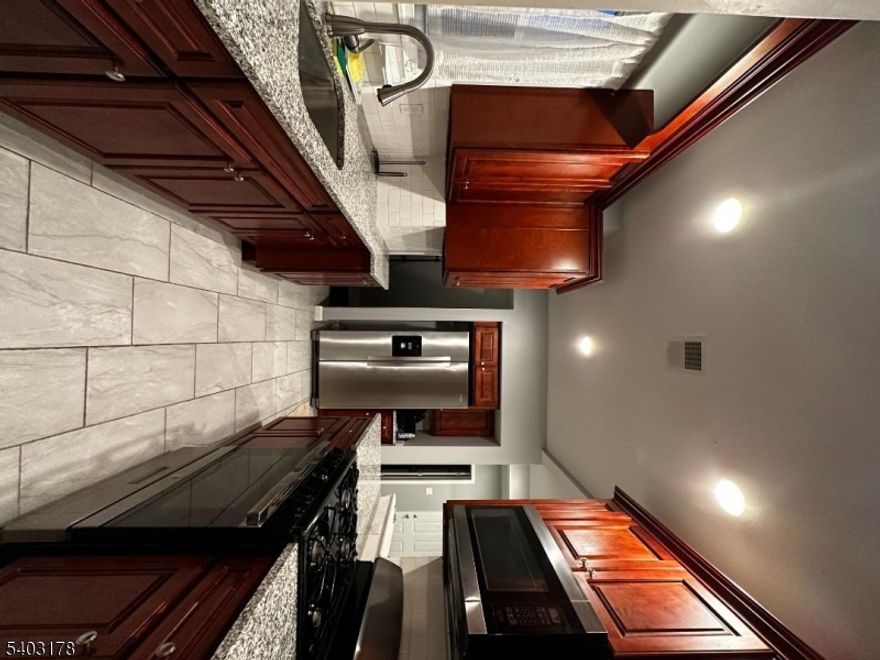 This turnkey, fully renovated two-family home presents an exceptional opportunity for investors to tap into Phillipsburg's rapidly emerging real estate market. Strategically positioned in a growing investment hub surrounded by new developments and modern amenities, this property is a high-performing asset designed for immediate cash flow. Both units are currently occupied by reliable tenants, making this a seamless "plug-and-play" addition for a seasoned pro or an ideal entry point for a first-time investor looking to build long-term wealth. The first-floor unit features a contemporary open-concept layout that flows beautifully into a fully finished basement, offering rare additional living space or storage. Upstairs, the second unit provides a spacious, multi-level retreat spanning two floors, giving it an expansive feel. With a total of four bedrooms and three full bathrooms, every inch has been updated to meet modern standards. Whether you are looking to expand your portfolio or secure a stake in one of the region's most promising revitalization zones, this income-producing home is a must-see.