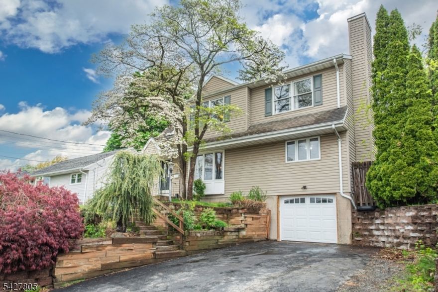 Tucked away on a quiet cul-de-sac in desirable Butler, this spacious Colonial offers versatile living across three fully utilized levels. Featuring 4 bedrooms and 3 full baths, the home includes a fully equipped lower-level living suite with its own kitchen and bath?ideal for extended living or guest accommodations. The main level showcases an open, flowing layout with hardwood floors, an inviting eat-in kitchen with sliders to a private, fenced backyard framed by mature landscaping. A warm and welcoming bonus space with French doors, custom built-ins, and a wood-burning fireplace provides the perfect setting for a den, office, or recreation room. A first-floor bedroom and full bath add flexibility and convenience. Upstairs, the expansive primary suite impresses with cathedral ceilings and access to a beautifully updated Jack-and-Jill bath featuring a large walk-in shower and skylights that flood the space with natural light. Two additional well-proportioned bedrooms complete the second level. Additional highlights include central air, ceiling fans, central vacuum, and public utilities. Ideally located near schools, shopping, major highways, and transportation, this home offers the perfect blend of comfort, space, and convenience.