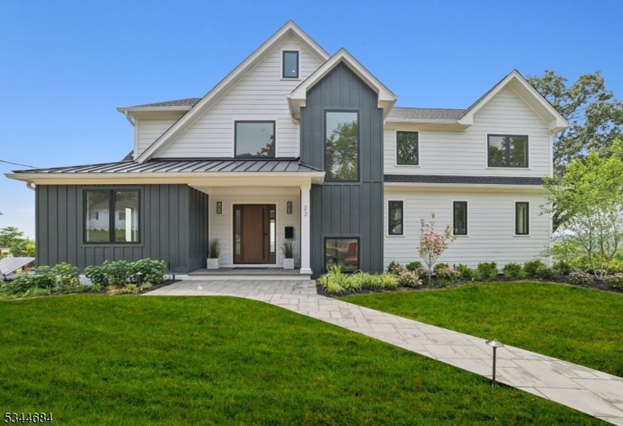 Luxury Living with Unmatched Views in Summit, NJ. Perched atop one of Summit's most coveted ridgelines, this newly renovated masterpiece offers breathtaking skyline views and refined living at its finest. This 6-bedroom, 4.5-bathroom home blends modern luxury with timeless craftsmanship across every inch of its design. Step inside to discover a custom-built kitchen outfitted with premium Wolf appliances, tailored cabinetry, and designer finishes perfect for both everyday living and elegant entertaining. The expansive layout features a seamless flow between living spaces, all filled with natural light and high-end detail. Retreat to your private master suite with its own walk-out deck overlooking the city skyline a tranquil escape for morning coffee or evening wine. An additional deck on the main floor provides even more outdoor living space for relaxing or hosting guests.With six spacious bedrooms, spa-inspired bathrooms, and upscale finishes throughout, this home offers room to grow and space to thrive all in one of New Jersey's most desirable communities.