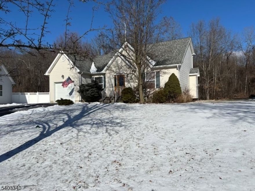 This charming Cape Cod has 3-bedrooms 2 baths home. Located on a quiet side street in the heart of Hamburg,offers comfort, privacy, and convenience. Built in 1997, this home boasts classic craftsmanship style throughout. There is a bright and airy layout , surroundings featuring a spacious living room/dining room combo with vaulted ceilings. Kitchen has plenty of cabinet space along with a breakfast bar. Off with dining room is large year round sunroom. The primary bedroom (on the 1st floor), includes a gas fireplace and ensuite bath. While two additional bedrooms (on the 2nd level) and a  2nd full bath, offers flexibility for guests or a home office. Full unfinished basement with high ceilings and a Bilco door exit provides great finishing potential. There is an oversized built-in one car garage, driveway can accommodates parking for 6 cars.The home has nicely landscaped yard, that backs to woods for out door living.