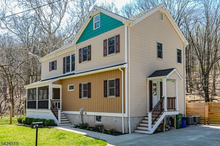 In a serene section of Skillman, where the wooded landscape creates a soothing naturalenvironment to come home to, this custom-built house supports a lifestyle defined by calm,comfort, and thoughtful design. A screened front porch greets you first, inviting long, unhurriedmornings and evenings framed by trees and filtered light. Inside, the home unfolds with a senseof craftsmanship and clarity. The kitchen anchors the main level, conceived as both a functionalworkspace and a social centerpiece. Quartz surfaces wrap the room in a clean, modern finish,while a suite of stainless-steel appliances supports serious cooking. A built-in double oven witha warming tray, microwave, dishwasher, refrigerator, and a five-burner cooktop with pot filler andhood reflect a deliberate attention to detail. Hardwood floors run through the kitchen, living, anddining rooms, providing warmth and continuity. Crown molding adds a tailored architectural note.Each of the three bedrooms is designed as a private suite, complete with its own full bath. Theprimary suite stands apart with a generous custom walk-in closet and a bath that reads like apersonal spa. Two vessel sinks sit atop refined surfaces, complemented by a soaking tub and aseparate shower. Outside, ample parking accommodates visitors with ease. A thoughtfullyplaced shed and an attractive privacy fence create structure without interrupting the organic feelof the setting. The patio and deck extend the living space outdoors.