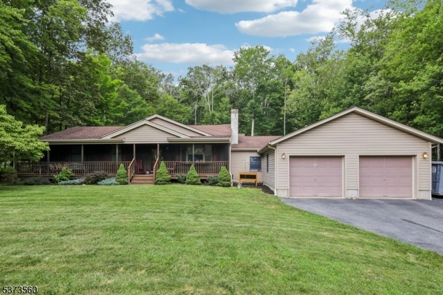 This stunning expanded ranch is nestled on nearly an acre of level, tree-lined land, offering privacy and a peaceful setting. The home features 3 bedrooms and 2 full baths, a covered front porch, a 2-car garage, and a full unfinished basement providing ample storage. Inside, the beautifully updated kitchen includes granite countertops, a center island, stainless steel appliances, soft-close Kraftsman cherry cabinets, hardwood floors, and a sink with a view of the backyard and above-ground pool. The spacious 20x21 family room is filled with natural light and features wood floors and a freestanding wood-burning stove, while the cozy living room has a wood-burning fireplace insert and a large picture window overlooking the front yard. A first-floor laundry room adds convenience, and updated bathrooms offer, new flooring, a modern vanity, and a new toilet. The back deck is perfect for entertaining and is connected to the side of the home by a paver walkway. With plenty of parking, storage, and thoughtful updates throughout, this move-in-ready home is the perfect blend of comfort, style, and outdoor living!