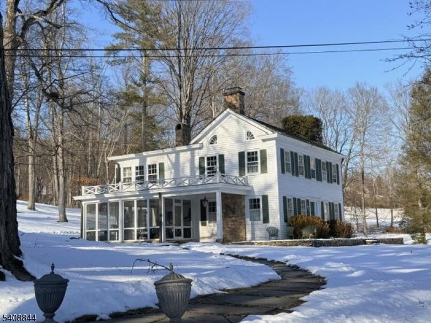 Circa 1820, The Princess Pyne Estate blends timeless character with an exceptional setting. Set on over 2 acres at 121 Mosle Road and including an additional 3+ acre parcel at 120 Mosle Road sold together the property offers both historic charm and rare land ownership. The main residence features 5 bedrooms and 2.1 bathrooms, a large front sitting room, a screened-in porch ideal for quiet relaxation, and a covered bluestone patio for outdoor enjoyment. Fireplaces are being conveyed strictly as-is. A separate cottage includes 2 bedrooms, 1 full bathroom, and a full kitchen, with a substantial 3-car garage below. The 120 Mosle Road parcel is deed-restricted and cannot be developed with a dwelling, preserving privacy and protecting the property's scenic views. A unique opportunity to own a storied estate with added acreage and long-term view protection in a sought-after location.