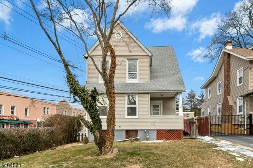 UNIQUE PROPERTY.!  This is a single family home that has 12 garages.  Use the garages income from the garages to help pay your mortgage.  Or maybe you have a car collection or a business that requires lots of storage. Move-in Condition with new painting and carpeting.  3rd floor loft area just finished with new sheetrock and painted wood flooring is bright and airy, could be used for clean storage, a yoga area or a quiet office space, you decide. Backyard fenced in for privacy.  New front porch floor and new rear steps. Vacant and ready for your decorating touches. So many options, rent the entire property for its positive cash flow income. Or use the entire property for personal use. Light and bright with many new windows.