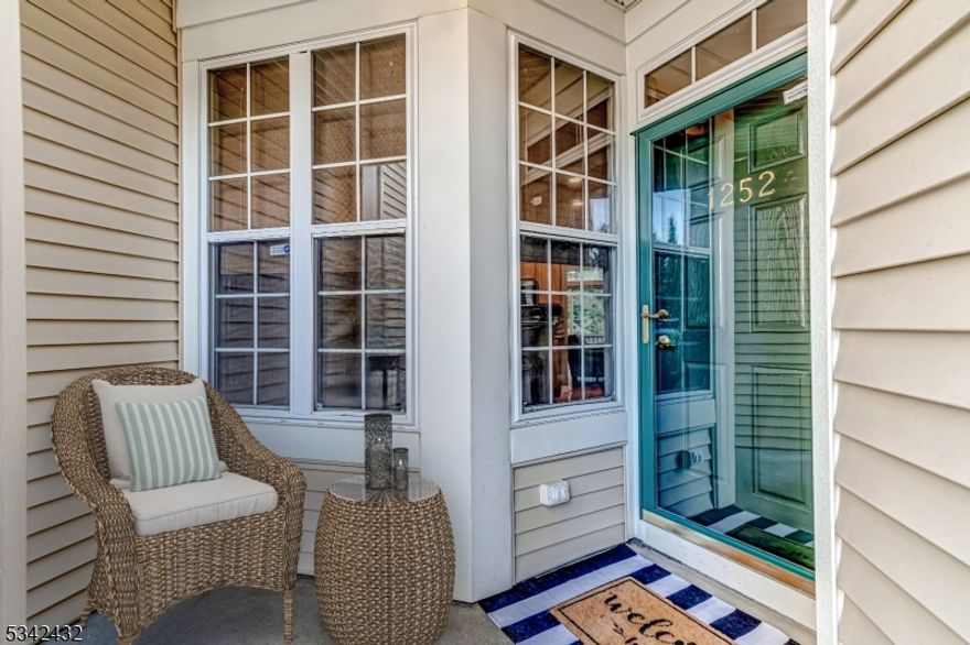 Nestled in the sought-after Overlook at Lopatcong, this beautifully updated townhome offers the perfect blend of modern comfort and convenience. A thoughtfully designed layout welcomes you with stylish upgrades & contemporary finishes. The heart of the home is the renovated kitchen, featuring stainless steel appliances, granite counters & backsplash & cozy breakfast nook perfect for cooking & casual meals. Just beyond, the spacious living room is bathed in natural light from large windows & features gleaming hardwood floors & two-sided gas fireplace, seamlessly connecting to the dining area. Sliding doors lead to a private deck perfect for outdoor dining or unwinding from a long day. The chic remodeled powder room, coat closet & garage wired for an EV charger complete the first level. Retreat to the second floor where the primary suite awaits. This sun-drenched sanctuary features cathedral ceilings, walk-in closet & newly renovated high-end spa bathroom. Enjoy a luxurious walk-in shower w/ rain shower head & custom accents. Two additional bedrooms, a renovated main bath, laundry and linen closet complete the second level. The partially finished walk-out basement with private patio is a fantastic bonus and ready to be customized to fit your lifestyle. The community boasts a tranquil ambiance & offers various amenities such as an outdoor pool, sand volleyball court, playground & clubhouse. Conveniently located near shopping & major hwys make this a prime location for commuters.