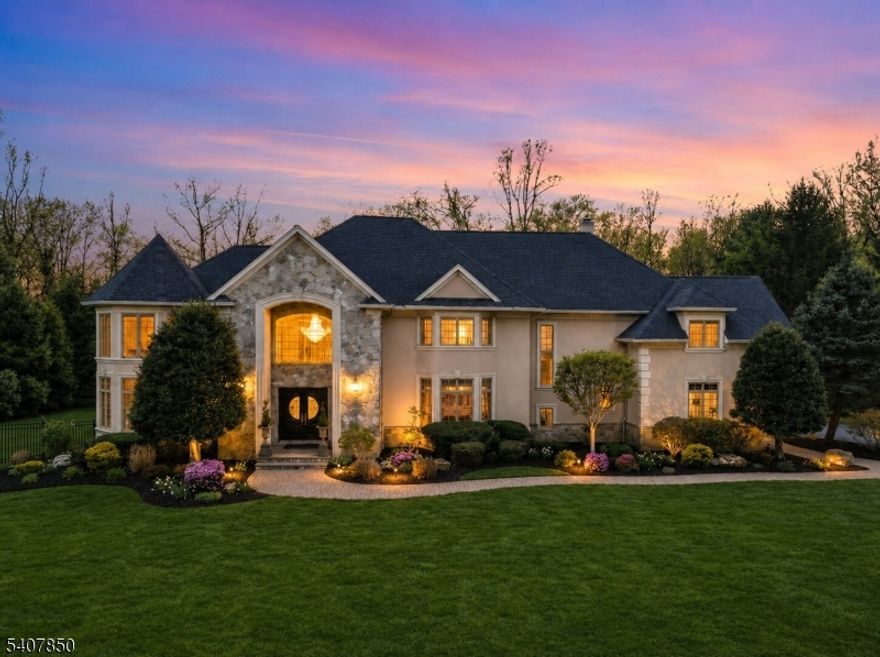 Welcome to 2 Stewart Court, a beautifully maintained residence tucked away on a quiet cul-de-sac in sought-after Old Tappan. Offering approximately 7,600 square feet of living space, this exceptional home includes a fully renovated 2,500-square-foot basement, featuring a wet bar, home theater, and versatile space ideal for entertaining. The home showcases a luxurious use of open volume throughout, highlighted by modern architectural lines and dramatic double-height ceilings in the entry foyer, great room, and primary suite. The great room is anchored by a wood-burning fireplace, creating a warm and inviting focal point. Enjoy picturesque views of Lake Tappan and stunning sunset vistas, while sun-filled interiors feature newly renovated bathrooms and new hardwood flooring throughout.Outdoor living is enhanced by a heated gunite pool with a brand-new pool cover. Recent updates completed within the last year include a new roof installed in January 2025 and a new hot water heater. Conveniently located near top-rated schools, parks, shopping, dining, and major transportation routes.Please see property disclosure for utility easement.