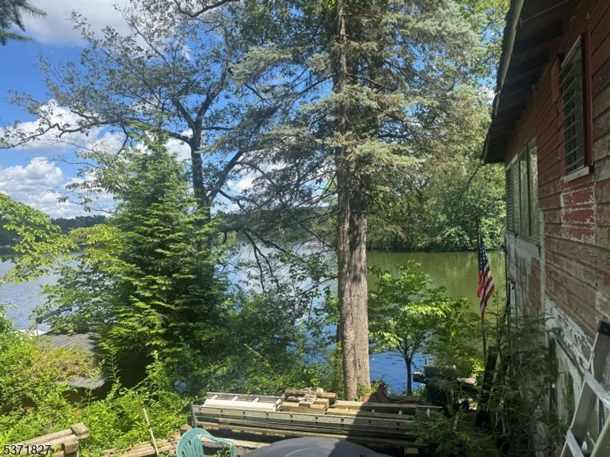 Bring your contractor and your imagination to transform this charming 3 bedroom, 1 bathroom Ranch nestled on the shores of Glen Wild Lake. This unique opportunity offers stunning lake views and the chance to create your dream home in a truly special setting. The main living area features a comfortable living room, dining room ideal for entertaining, and a kitchen ready for your vision. Three bedrooms and a full bathroom complete the first floor. A full unfinished basement offers endless potential to expand your living space, while the 2-car detached garage provides convenient vehicle or equipment storage. Enjoy the beauty and lifestyle of lakefront living kayaking, swimming, fishing, and gathering with neighbors in this vibrant lake community. With solid bones and timeless charm, this home is ready for your updates and personal touch don't miss this rare lakefront opportunity.