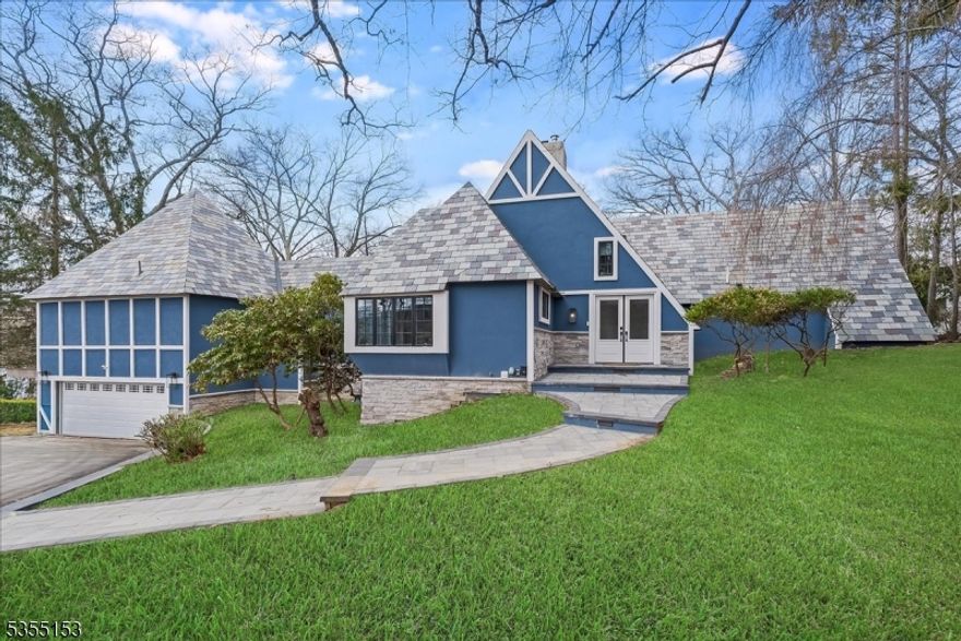 Luxury living on private Manitou Island. Peaceful and elegant with lake views from every window!  Beautifully updated maintaining its lake charm with a gorgeous slate roof, original stone fireplace and rustic living room. The first floor primary suite has a full bath, walk in closet, high ceiling and spacious deck to step outside into this beautiful setting. Open concept dining to take in the views, wet bar, cozy family room and well appointed chef's kitchen with a large pantry. Sliders lead you to extensive patios and heated, salt water gunite pool with updated equipment providing a great space for outdoor entertaining! About an hour to Manhattan.