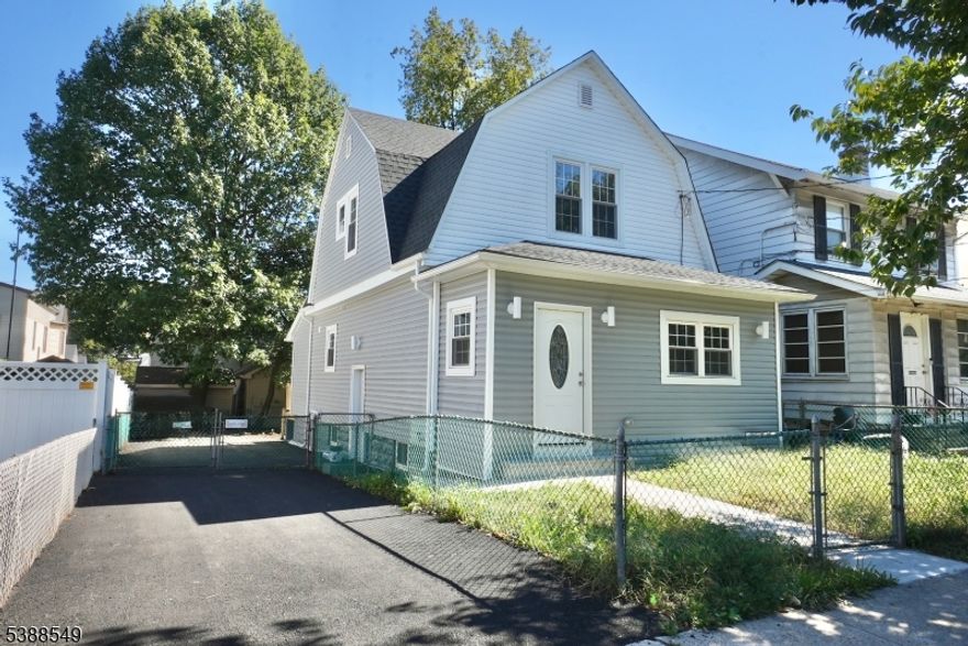 Welcome to this fully renovated Colonial, thoughtfully redesigned with an open-concept layout and over 2,000 sq. ft. of living space. This home features a spacious living room, formal dining room, brand-new modern kitchen, four bedrooms, and three beautifully updated bathrooms to suit today's flexible lifestyle.Step into a warm and inviting entryway with an enclosed porch and coat closet that opens to a bright, airy living room filled with natural light from large windows. The adjoining kitchen and dining area offer the perfect space for everyday living and entertaining, complemented by a convenient first-floor office.Upstairs, the private primary suite includes a stylish ensuite bath and generous closet space. The fully finished lower level enhances the home's versatility with a laundry room, ample storage, and a separate entrance leading to an additional recreation area.Conveniently located near NYC transportation, parks, and schools.
