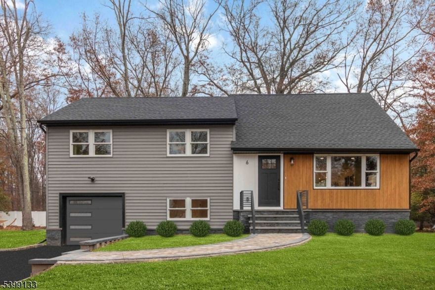 Gorgeous fully renovated custom home, completely brand-new inside and out. This stunning property features an open floor plan with hardwood floors throughout, beautiful custom trim and woodwork, and a high-end designer kitchen equipped with Bertazzoni Italian appliances. Enjoy a spacious breakfast bar and a formal dining room with direct access to the paver patio overlooking a large, level, private backyard perfect for entertaining and outdoor enjoyment. Generously sized bedrooms offer excellent closet space, while the spa-inspired bathrooms showcase elegant finishes, including a luxurious custom-tiled master bath. The versatile lower level provides endless options, whether used as an additional bedroom, home office, or family room. An oversized recreation/family room on the lower level adds even more flexible living space. Truly a move-in-ready home blending modern comfort with timeless craftsmanship.