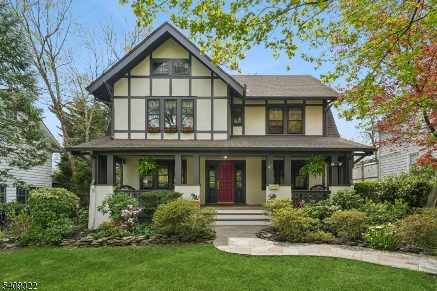 Set on one of Maplewood's most beautiful streets, this stunning Colonial delivers architectural integrity, elevated modern updates, and an exceptional lifestyle. A welcoming front porch with swings, coupled with classic curb appeal, creates an incredible sense of charm. Inside, a flowing floorplan of gracious, light-filled rooms showcases fine period details paired with thoughtful contemporary upgrades. The chef's kitchen, designed by Brooklyn-based Studio Nato & built by KDH, is a true masterpiece, featuring marble countertops, an AGA induction range/oven, custom inset cabinetry with solid brass hardware throughout, and a solid walnut center island. The kitchen opens to a sun-drenched breakfast room and mudroom, as well as the formal dining room, making daily living and entertaining effortless and enjoyable. Rounding out the first floor is an oversized Living Room and new Powder Room. Upstairs, five private Bedrooms and three full baths across 2 floors include a serene en-suite primary. The lower level offers a finished recreation room, powder room, laundry room, and storage. If you're seeking a true outdoor oasis, this deeply private backyard awaits, with lush landscaping, a trickling stream & footbridge, deck and patio anchored by a 2-car garage with a hidden surprise studio office, yoga studio, artist's space, or GarBar. Just 2 blocks from Maplewood's Award-Winning Village: shops, restaurants, NYC trains. A home where design, comfort, and community come together.