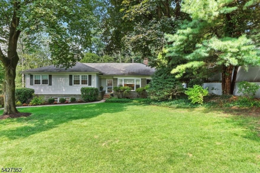 Spacious 4-Bedroom, 2.5-Bath Custom Ranch in Sought-After Convent Station. Beautifully updated offering the ideal blend of convenience, comfort, and style. The main level features an open-concept layout anchored by a living room & custom-renovated kitchen with a large island, granite counters, and stainless steel appliances. The formal dining room flows seamlessly through French Doors into the family room, complete with a custom bar and wine refrigerator perfect for entertaining. All four bedrooms and two full bathrooms are located on one level, including the primary suite with built-in cabinetry and a renovated private bath. The finished basement adds even more living space with a second family room, powder room, and generous storage area. An oversized two-car garage, new roof, new windows, hardwood floors, custom window treatments, and a walk-up attic with expansion potential further enhances the home's appeal. Step outside to enjoy the large, private fenced yard, complete with a paver patio and underground sprinkler system ideal for relaxing & gatherings. Perfectly located just 1 mile from Convent Station train station and vibrant downtown Morristown, This move-in ready home combines thoughtful updates with an unbeatable location. Don't miss the opportunity to call it home!