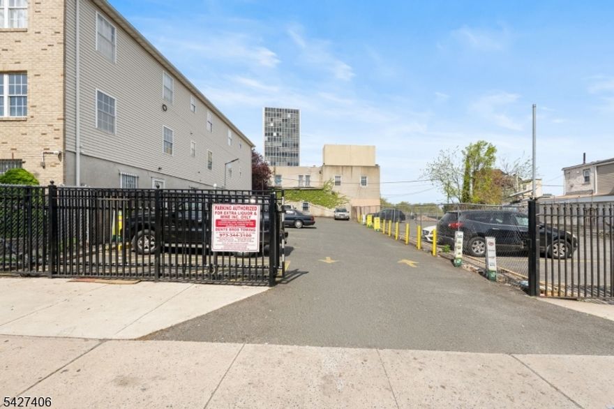 Presenting a unique investment opportunity in the heart of Newark?s rapidly evolving University Heights neighborhood. Currently utilized as a paved parking lot, this 19' x 108'parcel offers a deep footprint for creative urban development. While the lot is considered undersized by traditional standards, it stands to benefit significantly from Newark?s recent"Streamline Small Development" administrative changes. These updated local ordinances are designed to fast-track housing production by allowing three-family dwellings and othersmall-scale projects on grandfathered undersized lots to be approved administratively. This crucial shift potentially allows a developer to bypass the lengthy Planning Board hearing process. The property?s location on Orange Street, a recognized primary corridor, provides a versatile canvas for a mixed-use signature building. Prospective owners can explore adesign that incorporates a ground-floor commercial space to serve the high-traffic corridor, topped with high-density residential units. Although the 19-foot width naturally prohibits afront-facing driveway under current city codes, the path to development is clear through minor variances. A developer might seek a parking requirement waiver given the site'sexceptional transit proximity or satisfy requirements via a rear alley configuration. These small variances are well-supported by the city?s current push for "Transit-OrientedDevelopment" and the logistical realities of historic Newark lots. The location is a commuter?s dream and a magnet for the city?s professional and academic population. Situated just 5 blocks from the Orange Street Light Rail Station, residents enjoy a seamless five-minute connection to Newark Penn Station, offering world-class access to PATH trains, NJ Transit, and Amtrak for easy commutes to Jersey City and Manhattan. The property is also perfectly positioned to capture the robust rental demand from the neighboring University District, home to NJIT, Rutgers-Newark, and Essex County College. Beyond its commercial and transit appeal, the neighborhood offers significant lifestyle amenities. The property is located just 2 blocks from the iconic Branch Brook Park. This proximity to premium green space, combined with the administrative ease of the new "Streamline" rules, makes this property an ideal acquisition for a savvy developer looking to capitalize on Newark?s urban renaissance.