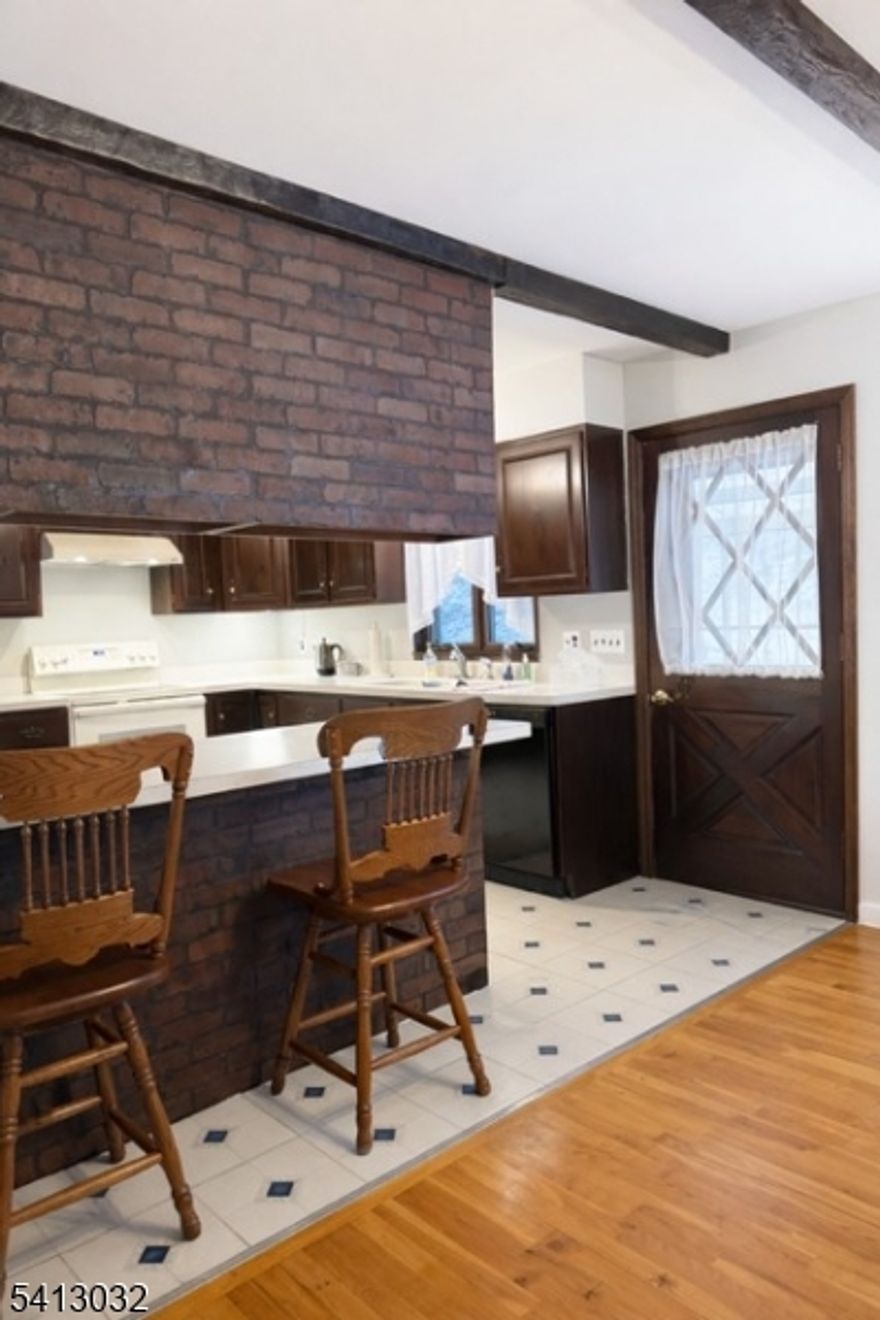 This 4 bedroom, 2.5 bath oversized bi-level is set on over 2 private acres in a secluded location, yet within walking distance to town and Blair Falls, offering the perfect balance of privacy and convenience. The home features hardwood floors throughout, 4 zone heating and 3 wood burning fireplaces, including one in the primary bedroom. The entire interior has just been freshly painted, providing a bright, move-in-ready feel. The kitchen opens to a deck overlooking the backyard, ideal for entertaining or relaxing. Additional highlights include an oversized heated garage and spacious shed with lean-to, complete with electric and water. This is an estate sale and is being sold As-Is, with no known issues. Septic was inspected and repaired (D-box). This is a wonderful opportunity to make this home your own in a highly desirable setting.