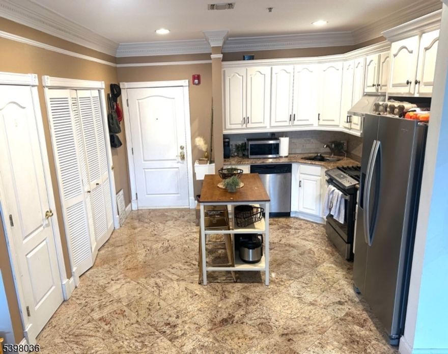 Welcome to this bright 1 bedroom condo, located in the desirable Ironbound section of Newark. Features 1 large full bath, with double sink vanity, jacuzzi tub, and stand up shower. Also features a beautiful white cabinet kitchen with an island, large living room, ample closets throughout, hardwood floors, balcony, and laundry in unit! Prime location for transportation, parks, schools, and shopping