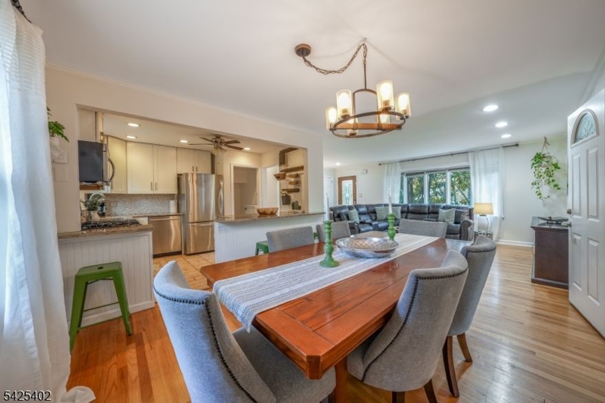 Welcome to this charming, recently renovated 3-bedroom, 2-bath home nestled on a tree-lined street in the highly sought-after community of Livingston. This inviting residence offers a warm and functional layout designed for both everyday living and easy entertaining. The main level features a bright living room with a gentle curve of windows, a dedicated dining area, and a sun room that brings in abundant natural light perfect for a home office, reading nook, or relaxation space. The kitchen is centrally located with convenient access to the dining area, making mealtime flow effortlessly. Three well-proportioned bedrooms, including a spacious primary bedroom, and a full bath complete the first floor. The lower level expands your living space with a large recreation room, an additional full bath, a versatile family room, and a generous utility area ideal for storage, hobbies, or future customization. An attached garage adds everyday convenience. Step outside to a sizable patio and expansive backyard, offering endless possibilities for outdoor entertaining, gardening, or creating your own private retreat. Ideally located near top-rated schools, parks, shopping, and NYC transportation, this home presents a fantastic opportunity to enjoy suburban living with commuter-friendly access. With great bones and a flexible layout, it's ready for your personal touch to make it truly your own.