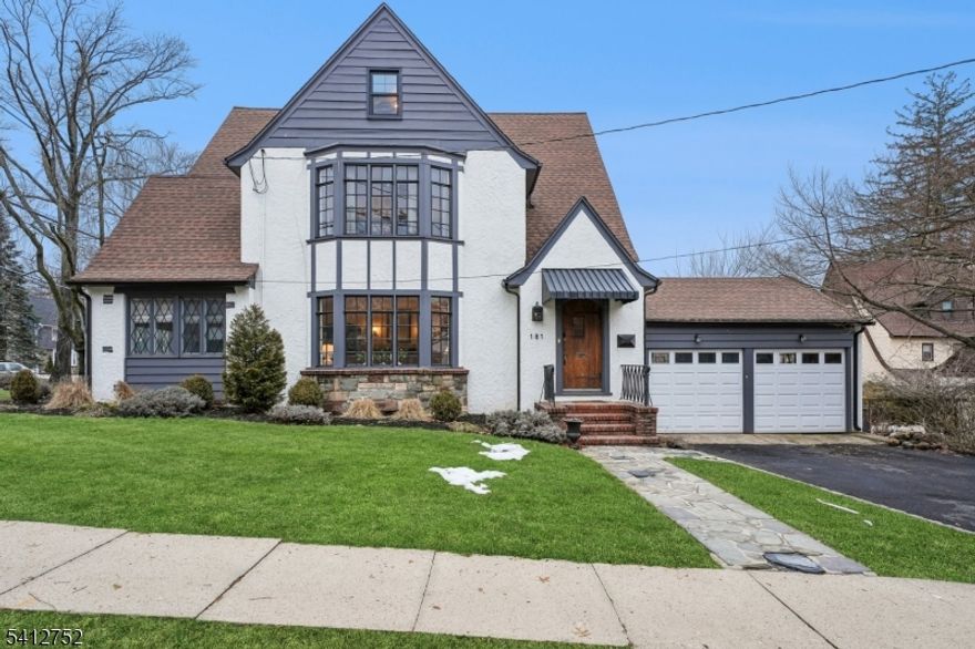 This beautifully updated five-bedroom, three-bath home blends timeless architectural charm with modern updates. A welcoming foyer sets the tone for the home's character and generous proportions. Rich natural hardwood floors, several original leaded-glass windows restored to perfection, and a striking wood-burning fireplace framed in slate and stone create a warm, comfortable atmosphere. The spacious living room is filled with natural light, while French doors open to a stylish Family Room. Designed for both everyday living and entertaining, this home features a formal dining room and a thoughtfully renovated kitchen appointed with quartz countertops, custom cabinetry, stainless steel appliances, and a separate breakfast nook.  The newly updated primary bath features fresh, contemporary finishes. Plus a new central air system and new windows throughout the home, ensure modern comfort.  The property includes a two-car garage.  An exceptional residence for those who appreciate timeless design and the comforts of contemporary lifestyle.  Welcome home!