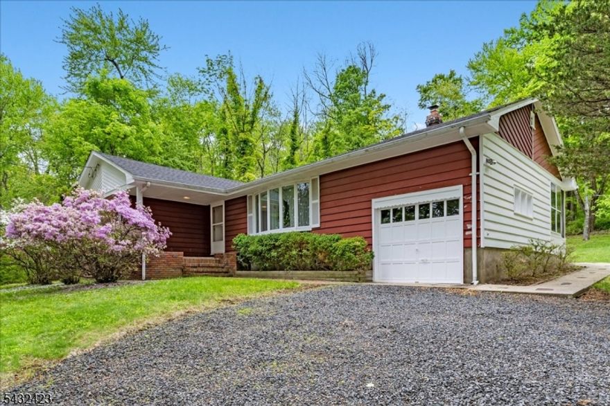Step into this immaculate and charming time-capsule of a home, where timeless character and exceptional craftsmanship shine throughout. From the moment you enter, you'll notice the quality details rarely found in newer homes, including exposed beams, a hardwood tongue-and-groove kitchen ceiling, a custom wood range hood, striking hardwood cabinetry, elegant crown molding, and beautifully preserved original hardwood floors. The finished basement adds even more living space with traditional real hardwood paneling and two additional bonus rooms, perfect for a home office, guest space, hobby room, or gym. Outside, enjoy the beauty and privacy of a large backyard and a combined 5-acre mostly wooded property, made up of two separate lots included in the sale offering a rare opportunity for space, seclusion, and endless potential. Septic is original to house. House is being Sold AS IS.