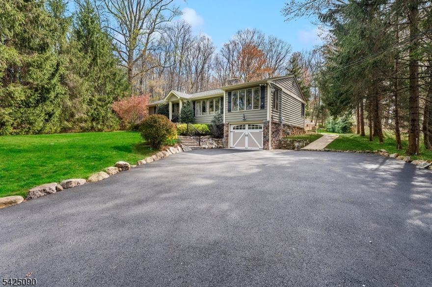 Welcome to this charming ranch-style home in Montville, perfectly tucked away in a peaceful wooded setting while just minutes from downtown, major highways, and everyday conveniences. This one-floor living home offers 3 bedrooms and 2 full baths, with a spacious layout designed for both comfort and functionality. The large living room features a cozy wood-burning fireplace, flowing seamlessly into a formal dining room and an eat-in kitchen ideal for everyday living and entertaining alike. The finished lower level expands your living space with a generous recreation area, along with a utility and laundry space, mudroom, and direct access to the one-car garage. Step outside to a beautiful paver patio overlooking a private, serene backyard perfect for relaxing, entertaining, or simply enjoying the natural surroundings. A rare opportunity to enjoy quiet living with unmatched convenience this home truly offers the best of both worlds.