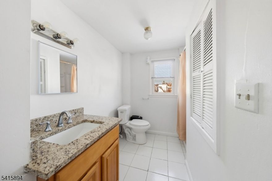 This spacious three-bedroom, one-bathroom apartment in Elizabeth, NJ offers comfortable living in a highly convenient location. The unit features well-proportioned bedrooms, a bright living area, and a functional kitchen with ample cabinet space, providing plenty of room to relax and enjoy everyday living. Large windows allow for natural light throughout the apartment, creating a warm and inviting atmosphere. Conveniently situated within walking distance of the Elizabeth Train Station and major bus stops, commuting to nearby cities and surrounding areas is quick and easy. With close proximity to local shops, restaurants, and everyday essentials, this apartment provides both comfort and accessibility in the heart of Elizabeth.